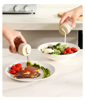 Bouteille à épices multifonctionnelle en verre rotative à portion contrôlée, distributeur d'assaisonnements à une main pour la cuisine (vente en gros)