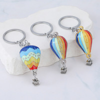Nouveau style créatif, pendentif rond en alliage de zinc, porte-clés montgolfière, souvenir de sport de plein air, cadeau nuage, vente en gros