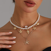 Collier de perles avec pendentif étoile de mer, style européen et américain, pour femme, thème marin, idéal pour les vacances d'été à la plage, en bambou