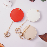 Miroir de maquillage rond en cuir PU avec porte-clés, mini miroir cosmétique portable, miroir de poche tendance pour femmes, cadeau