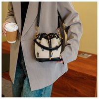 Sac à bandoulière grande capacité tendance et personnalisé en PU pour femme, nouveau sac seau à cordon mignon et texturé avec motif dessin animé