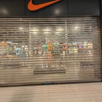 Système de porte transparent mais sécurisé, portail roulant automatisé pour centres commerciaux, magasins et entrées de garage
