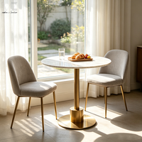 Table à manger ronde de luxe en marbre avec piétement doré pour balcon de café-restaurant ou appartement