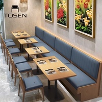 Ensemble table et chaises rondes en bois massif pour restaurant occidental commercial, idéal pour les groupes et les zones de conversation, parfait pour les collations.