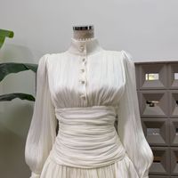 Robe élégante pour femme, style jupe courte, nouvelle collection automne, avec manches bouffantes, taille cintrée, bordure à volants, tendance