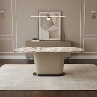 Table à manger ovale minimaliste italienne en marbre pour 6 personnes avec pieds en acier inoxydable pour villa et appartement
