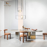 Table à manger de luxe en marbre, base métallique unique, plateau ovale en pierre, taille personnalisée, mobilier de salle à manger pour villa, décoration artistique moderne