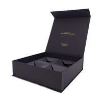 Boîtes cadeaux rigides en carton noir pour cosmétiques et parfums, avec logo personnalisé, couvercle à rabat magnétique et insert en mousse.