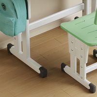 Bureau d'école pour enfants avec chaise, vert clair, bordure blanche, rangement ouvert et hauteur réglable pour une utilisation en classe