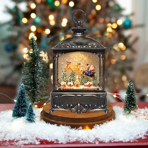 Globe à neige personnalisable avec un Père Noël et des rennes gonflables sur un village de Noël avec LED - Product Image 2