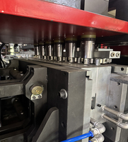Machine de soufflage de bouteilles entièrement automatique avancée à neuf cavités adaptée à la fabrication de bouteilles d'eau