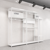 Étagères de présentation de vêtements en acier inoxydable doré sur mesure, 2 niveaux, sur pied, pour boutiques