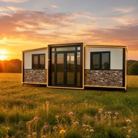 Maison modulaire préfabriquée moderne, maison préfabriquée à ossature en acier noir, maison en kit, bande lumineuse LED, mur en placage de pierre, cour arrière