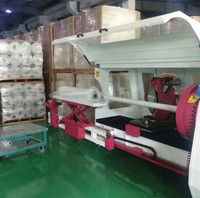 Machine automatique de découpe de ruban adhésif pour rouleaux de papier