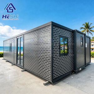 บ้านคอนเทนเนอร์สำเร็จรูป HESHi ขนาด 20 ฟุต 40 ฟุต แบบขยายได้ โครงสร้างเหล็ก ดีไซน์ทรงสี่เหลี่ยมผืนผ้า สำหรับการใช้งานกลางแจ้ง - Product Image 1