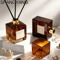 Bouteille diffuseur de parfum en verre plat rond décoratif 100ml 150ml, transparente ou ambrée, vide, pour arômes, MOQ 200 pièces, avec bouchon couronne.