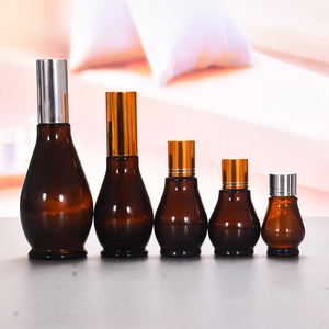 Bouteilles de parfum ambré de luxe en gros de 5ml à 100ml d'huiles de finition mate de forme ronde crème pour le visage logo personnalisé bouchon à vis boîte d'emballage - Product Image 2