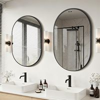 Miroir intelligent mural ovale moderne, écran tactile, design sans cadre. Lumières LED à 3 couleurs entourant le bord. pour Salon Apartment