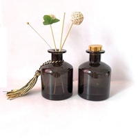 Vente en gros de flacons diffuseurs de parfum en verre rond transparent ambré noir gris de 50 ml 100 ml 150 ml 200 ml