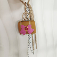 Nouveau porte-clés tendance pour femme avec nœud papillon, mini sac décoratif en PU en forme de sac, cordon de suspension populaire