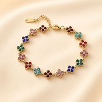 Nouveauté transfrontalière : Bracelet trèfle à quatre feuilles, design élégant et avant-gardiste, entièrement pavé de zircons, haute qualité