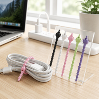 Attache-câble en silicone double trou en forme de gourde, réutilisable, multifonctionnel et coloré pour le regroupement de câbles (vente en gros)