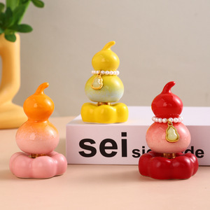 Adorno giratorio de cerámica con forma de calabaza, decoración de escritorio en miniatura para la buena fortuna, consola central del coche, atrae la riqueza - Product Image 1