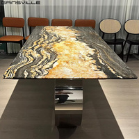 Table à manger de luxe en métal de Foshan, design unique, plateau en marbre, ensemble table et chaises Esstisch