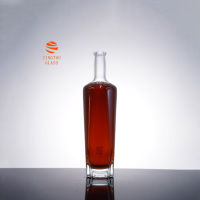 Bouteille de liqueur en verre transparent cylindrique de 700 ml, bouteille en verre à fond épais irrégulier pour la vodka, le gin, les spiritueux, vente en gros