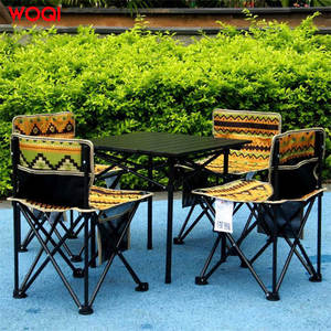 ชุดโต๊ะและเก้าอี้พับได้ Woqi สำหรับกลางแจ้ง 4 ที่นั่ง โครงเหล็ก พกพาสะดวก เหมาะสำหรับตั้งแคมป์ รูปทรงสี่เหลี่ยมผืนผ้า ใช้สำหรับชายหาด เดินทาง และรับประทานอาหาร - Product Image 1
