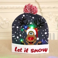 Decorazione della festa di natale ha portato i berretti di Babbo Natale con luce calda lavorata a maglia cappellino per adulti cappelli natalizi con luce a Led
