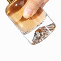 Flacon de parfum rond en verre de luxe 30ml 50ml 100ml avec fond coussiné en forme de cylindre pour l'emballage de cosmétiques et de soins corporels