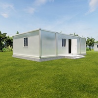 Maison conteneur de luxe préfabriquée démontable de 40 pieds, type flat pack, modulaire, avec 2 chambres, cuisine et séjour.