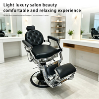 Fauteuil de barbier pivotant inclinable Qunpeng, style rétro, luxe, capitonné, en cuir noir, base argentée, robuste, pour hommes, salon de coiffure