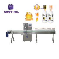 Ligne de production de miel compacte à tête unique contrôlée par PLC avec fonction de désinfection et étiquetage de flacons en verre connectables