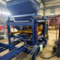 Machine à blocs de maçonnerie en béton QT4-15B pour une fabrication de briques efficace