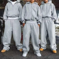 Fabricant de survêtements décontractés personnalisés : Survêtement streetwear en coton 100% épais, coupe ample, avec sweat à capuche zippé uni et pantalon de jogging à cordon de serrage