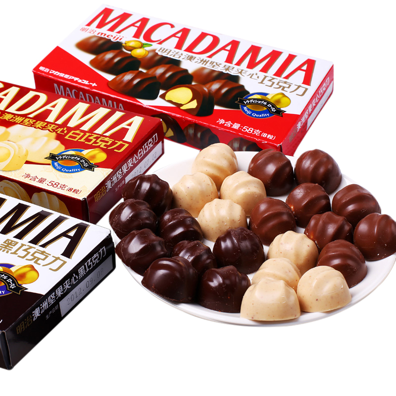 Экзотические шоколадные конфеты, закуски, темный шоколад, покрытые орехами макадамии