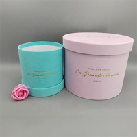 Boîte cadeau de fleurs de luxe personnalisée avec logo en feuille d'or, revêtement UV, laminage mat, carton recyclé, forme ronde