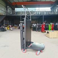 Chariot électrique pliable pour la montée d'escaliers, destiné au transport de charges de ciment dans la logistique et l'entrepôt