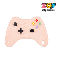 Direct usine, Vente en gros, OEM : Jouet de dentition pour bébé en silicone en forme de dinosaure, avec fonction de massage des gencives, style manette de jeu, en une seule pièce