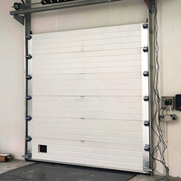 Porte sectionnelle industrielle victorienne robuste avec isolation thermique pour applications en cour