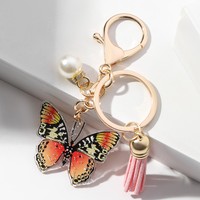 Vente en gros porte-clés personnalisé imprimé de luxe fermoir mousqueton perle papillon pendentif style dessin animé sac voiture acrylique porte-clés gland
