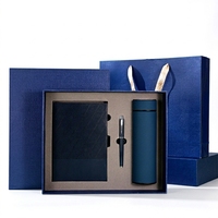 Coffret cadeau d'affaires en cuir personnalisable de luxe, comprenant un carnet A5, un stylo et une tasse isotherme.