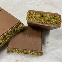 Barra de chocolate de pistacho de alta calidad a precio de fábrica, barra de chocolate de pistacho con sabor a Dubai, llena de rellenos.
