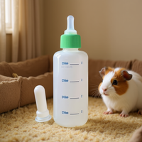 Grand biberon en plastique réutilisable arrondi avec tétine et brosse pour l'alimentation des petits animaux
