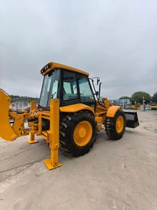 Chargeuse sur pneus JCB 4CX jaune avec pelle et bras hydraulique pour travaux de construction - Product Image 1