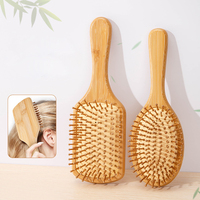 Brosse à cheveux en bambou écologique naturelle démêlante avec logo personnalisé et manche massant