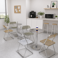 Transparenter Acryl-Klappstuhl Polierter Metall-Bistrotisch-Set Minimalistisches Café Coffeeshop Interieur