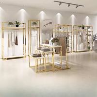 Présentoir de vêtements en acier inoxydable doré personnalisé au détail Boutique Présentoirs de vêtements